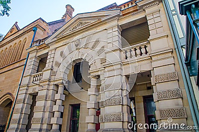 The beautiful sandstone building is the old Police Station, was also the site of the first hospital on George St, the Rocks. Editorial Stock Photo
